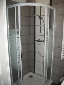 a shower with a glass enclosure in a bathroom at Les Mouettes in Le Tréport +16 photos