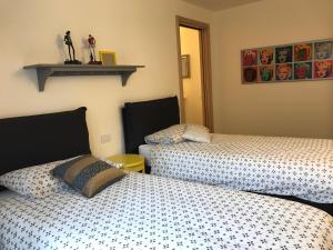 Katil atau katil-katil dalam bilik di Appartamento Carducci