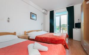 Postel nebo postele na pokoji v ubytování Motel Jadranka