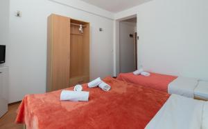 Postel nebo postele na pokoji v ubytování Motel Jadranka