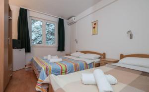 Postel nebo postele na pokoji v ubytování Motel Jadranka