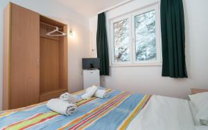 Postel nebo postele na pokoji v ubytování Motel Jadranka