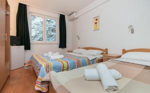 Postel nebo postele na pokoji v ubytování Motel Jadranka