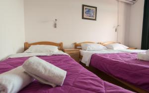 Postel nebo postele na pokoji v ubytování Motel Jadranka