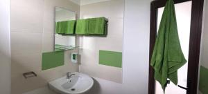 a bathroom with a sink and a mirror at Casa de la Corbu in Corbu +33 photos