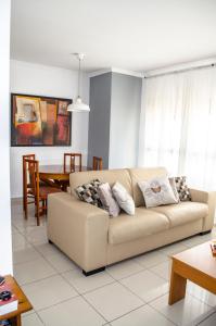 a living room with a couch and a table at Coral Dream in Las Palmas de Gran Canaria