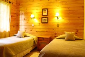 Postel nebo postele na pokoji v ubytování Cabañas Playa Linda