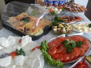 a table topped with lots of different types of food at Willa Kolor in Ustroń