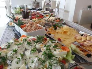 a buffet table filled with different types of food at Willa Kolor in Ustroń