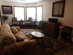 a living room with a couch and a table at Dutton Inn in Branson