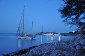 a group of boats docked in a body of water at Vrahos Boutique Hotel in Karavostasi