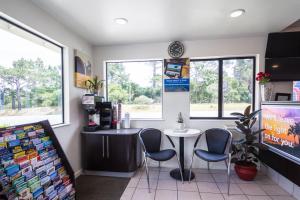 a waiting room with a table and two chairs at Motel 6 - Downtown Monterey in Monterey