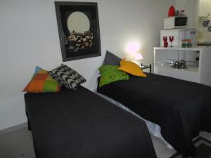 Кровать или кровати в номере Temporada Rio Studio Lily 2 - Perto do Cristo e de Copacabana