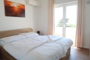 Postel nebo postele na pokoji v ubytování Villa Sunshine + 37 fotografií