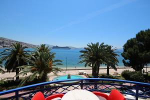 a view of the beach from the balcony of a resort at Hotel Ari in Sarandë