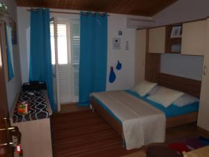 Postel nebo postele na pokoji v ubytování Apartment Duje