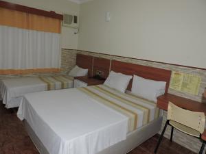 Säng eller sängar i ett rum på Hotel Brooklin