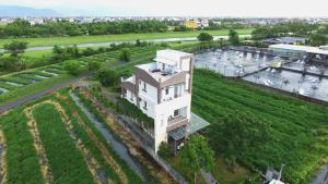 an aerial view of a building with a river at Mei Shiou B&B in Dongshan