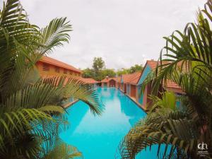 Bazén v ubytování SAJ Earth Resort & Convention Center , Kochi nebo v jeho okolí