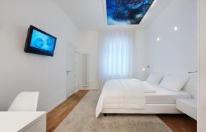 TV a/nebo společenská místnost v ubytování Boutique Hotel Imperialart