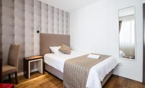Krevet ili kreveti u jedinici u okviru objekta Hotel Alpha
