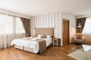 Ένα ή περισσότερα κρεβάτια σε δωμάτιο στο Hotel Alpha