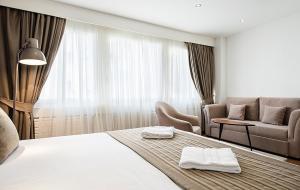 Krevet ili kreveti u jedinici u okviru objekta Hotel Alpha