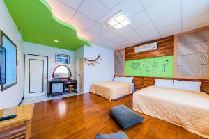 Voodi või voodid majutusasutuse Kending Fengcai Homestay toas