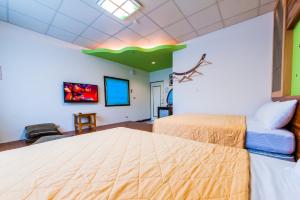 Voodi või voodid majutusasutuse Kending Fengcai Homestay toas