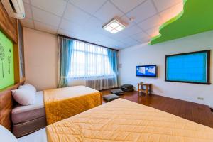 Voodi või voodid majutusasutuse Kending Fengcai Homestay toas