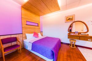 Voodi või voodid majutusasutuse Kending Fengcai Homestay toas