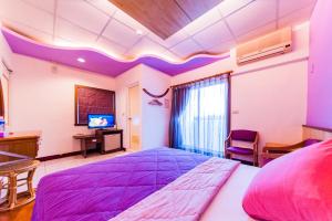Voodi või voodid majutusasutuse Kending Fengcai Homestay toas