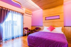 Voodi või voodid majutusasutuse Kending Fengcai Homestay toas