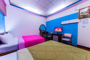Voodi või voodid majutusasutuse Kending Fengcai Homestay toas