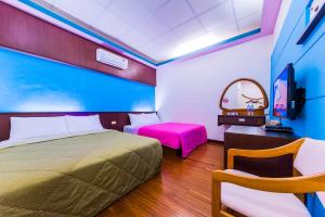 Voodi või voodid majutusasutuse Kending Fengcai Homestay toas