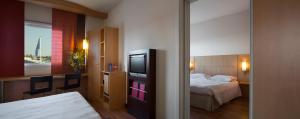Postel nebo postele na pokoji v ubytování Hotel Rafael