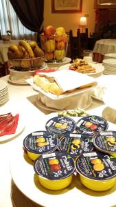 a table with plates of food on top of it at Quari Hotel Restaurant & Pizza in Cologna Veneta