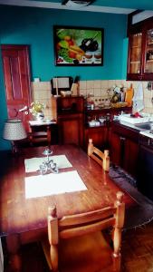 a kitchen with a wooden table in a kitchen at Vila De turist in Nova Varoš