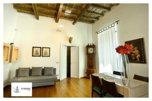 a living room with a couch and a table at Bonadies Suite in Barletta