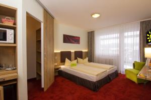 Postel nebo postele na pokoji v ubytování Aparthotel am Rennsteig + 15 fotografií