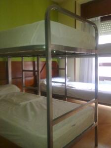 a couple of bunk beds in a room at Moon Hostel Bio in Bilbao