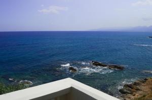 a view of the ocean from a building at Andromeda Apartments & Studios in Hersonissos
