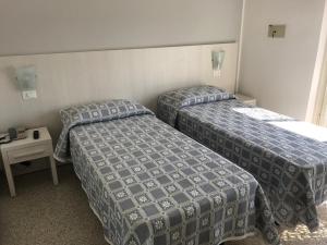 Postel nebo postele na pokoji v ubytování Hotel Annita Cervia
