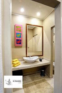 a bathroom with a sink and a mirror at Bonadies Suite in Barletta