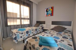 Postel nebo postele na pokoji v ubytování Playa Elisa Bay + 37 fotografií