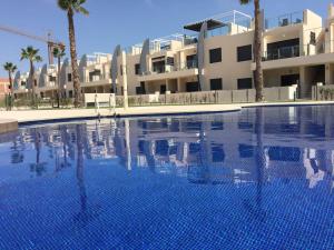 Bazén v ubytování Playa Elisa Bay nebo v jeho okolí