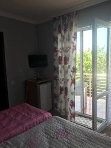Voodi või voodid majutusasutuse Kvariati - Guest House toas