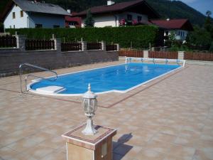 a swimming pool with a light in the middle at Landhaus Neuwirth in Pruggern