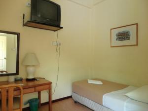 Postel nebo postele na pokoji v ubytování Pristine Hotel