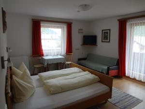Postel nebo postele na pokoji v ubytování Haus Bergheimat